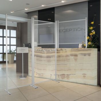Clear floor standing office screens in reception area