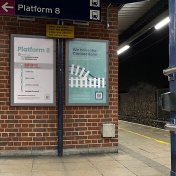 Double royal lockable poster cases providing travel information on a rail platform wall
