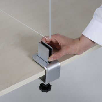 Desk divider clamps to secure perspex screen across a table