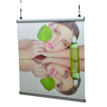 Banner hanging bars being used to hang a beauty promotion poster