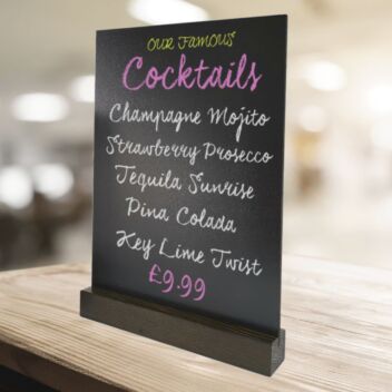 Cocktails listed on a table chalkboard