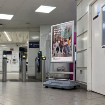 Double royal poster stand in rail concourse