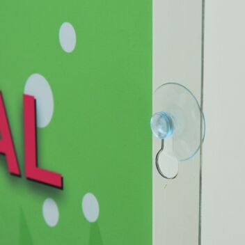 Suction cup for mounting poster pocket to glass